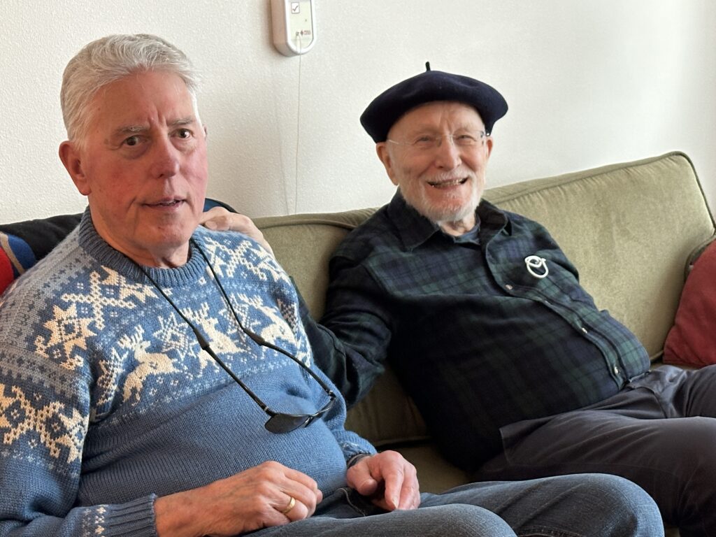 Two men sitting on a couch
