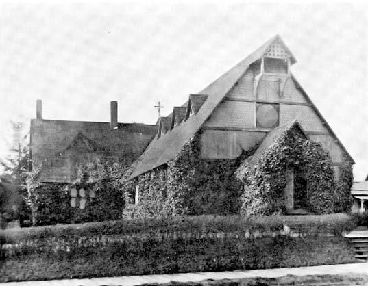 A church building covered in vines